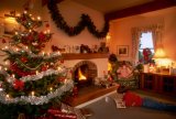UK, country home interior. Christmas scene by fireside, with children.