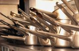 Stacks of chefs pans in restaurant kitchen