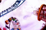 Fairground: leisure holiday vacation relax exciting exhilirating thrill ride big wheel helter skelter dipper fun fayre scream shout colourful bright 