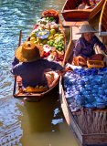 Two Traders in Boats at Floating Market - Thailand