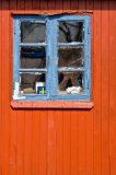 Old window in a wooden shack