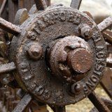 Castle Ward,Strangford,County Down,Northern Ireland,UK:parts of old rusting farm machinery on display on the estate.