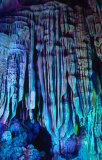 A luridly lit stalactite inside Reed Flute Cave; Guilin, Guangxi province, southwest China.