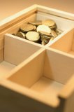Coins in Wooden Box