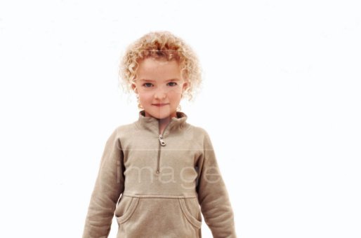 Curly haired blonde girl posing for the camera.