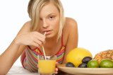 Woman sipping orange juice
