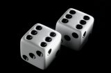 Pair of white dice showing number six