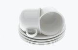 White cups and saucers on white background
