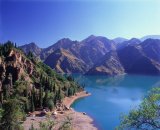 Heaven Lake, in the Tianshan Mountains, with Kazakh yurts; Xinjiang, northwest China.