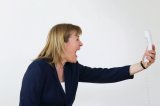 Woman shouting at telephone