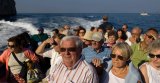 Capri Island, Campania, Italy, Europe: view of tourists enjoying the sights aboard pleasure craft.