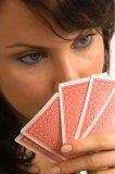 Extreme closeup of a woman playing poker.