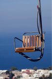 Capri Island, Campania, Italy, Europe:view of empty chair on the Monte Solaro chairlift.