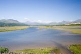 Snowdonia hills including Knicht and Moelwyn Mawr mountains and the Glasyn river from the cob Porthmadog,Snowdonia,Wales