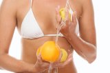 Woman washing citrus fruits