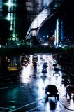 Wet city traffic in Shibuya Crossing Tokyo