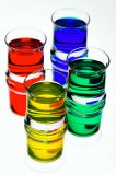 Coloured fantasy drinks in shot glasses