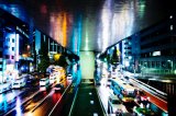 Wet city night in Shibuya Crossing Tokyo