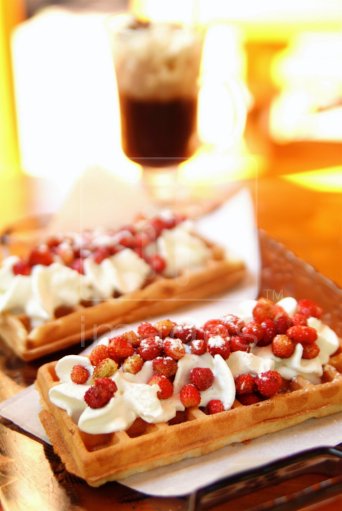 Waffles with whipped cream and wild stawberries. Szczawnica Spa. Poland