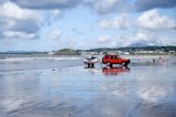 Getting ready to launch a jet ski, Black Rock sands North Wales with Criccieth castle in the background